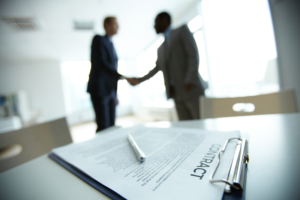Business partners shaking hands